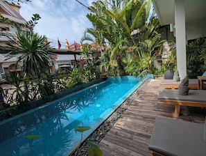Refresh, relax, and recharge by the pool at Baahu Villa