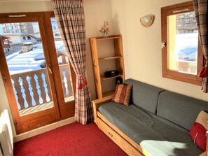 Light and airy living room with sofa bed
