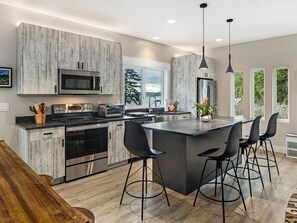 Full gourmet kitchen with water view