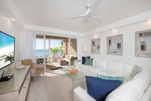 Living area with walk-out access to balcony.