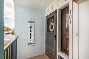 Front door. 'Hello' sign can be flipped to 'Go Away!'.