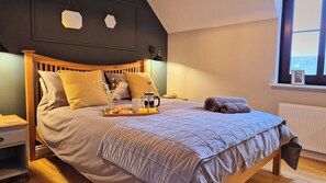 Master bedroom with king size bed and sea views. Ensuite bathroom