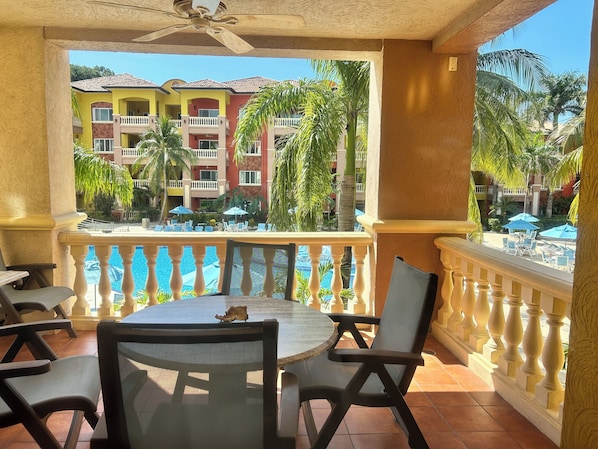Huge front deck overlooking the pool with partial ocean views