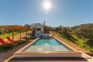 Incredible  swimming pool with great shadows, loungers and hammocks