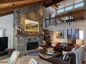 The Great Room boasts an impressive stone fireplace & comfortable seating areas.