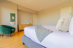 Elegant bedroom with a bed and sofa