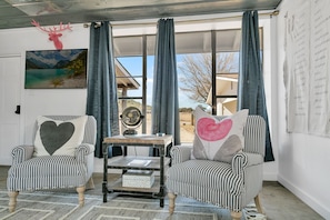 Relax and savor your morning coffee in the cozy sitting area for two. The perfect spot to enjoy a quiet moment and plan your day ahead.