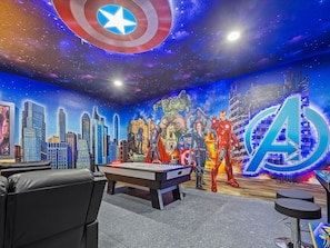 Game room with Air Hockey and arcade games. Dimming lights and A/C