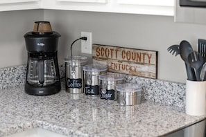 Coffee maker, coffee, tea & sugar provided. We have an electric tea kettle for the tea as well.