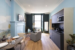 Studio with bed and kitchen