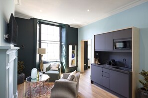 Studio with bed and kitchen