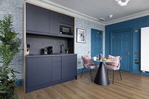 Studio with bed and kitchen