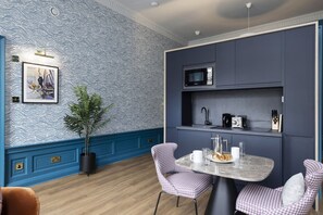 Studio with bed and kitchen
