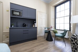 Studio with bed and kitchen