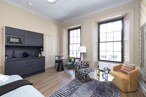 Studio with bed and kitchen
