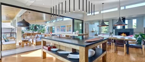 Gourmet kitchen, fully stocked for all your cooking needs and a custom island with a live edge counter and bar seating for 4