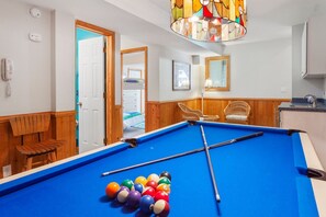Step over to the recreation room with a pool table, a wet bar, and a bar refrigerator!