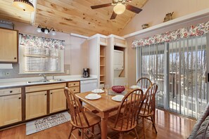 Kitchen and Dining with Sliding Glass Doors to the Deck