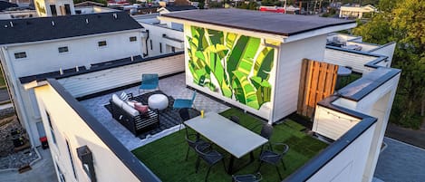 Rooftop Patio with Photo Mural and outdoor seating/dining. (4th Floor)