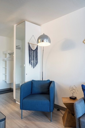 Comfortable seating options along with a full length mirror and ample closet space.