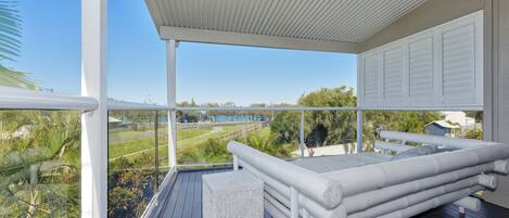 Upper deck with day bed, ocean & park view