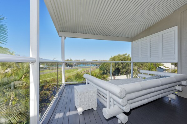 Upper deck with day bed, ocean & park view