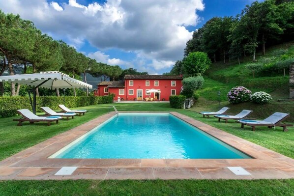 View from the pool to the villa