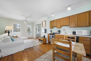 FULLY EQUIPPED KITCHEN NEXT TO DINING SPACE FOR TWO