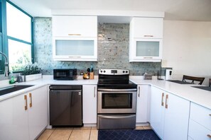 Moving on into the kitchen area, where you will find everything you need to cook up a 3 course meal or serve up a quick snack. With all the appliances ranging from the cooker, stove, refrigerator, freezer, microwave & coffee maker!