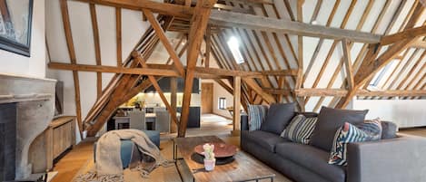 Beautiful and spacious living area with wooden beams