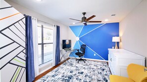 Your own personal workstation room, with beautiful, accented walls to inspire creativity.  There's also a queen-size murphy bed that can be easily set up for two extra guests to sleep.