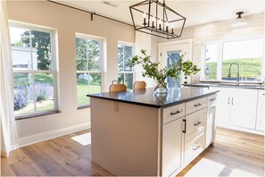 Downstairs kitchen island w/ bar seating for 2; beautiful countryside views