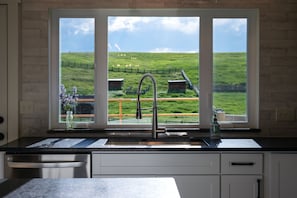 Downstairs kitchen sink overlooks back pasture