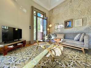 Living area with cozy traditional Portuguese tapestry in natural wool 