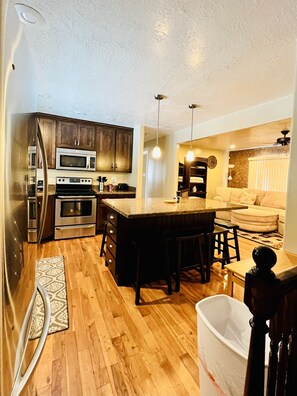 Fully stocked Kitchen to prepare meals, nice appliances, comfortable seating. 