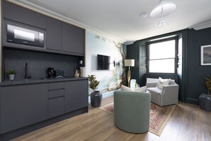 Studio with bed and kitchen