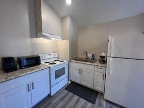 Full Kitchen with microwave, Keurig, spices, cooking utensils and glassware