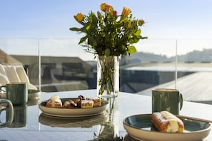 Enjoy a meal and the views on the sunny balcony
