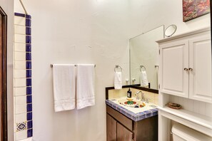 Full bathroom with a standing shower