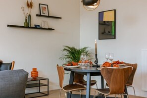 The dining room is a delightful space furnished with a round table and is perfect for small groups or a family.