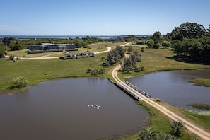 property with view of guest and caretaker house - main house is at the very back