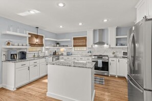 Kitchen with sleek white cabinets for a fresh and modern look.