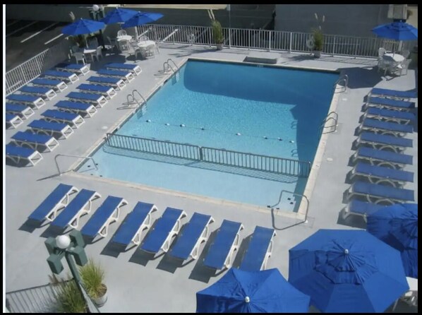 Heated Pool with plenty of lounge chairs. 