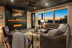 Cabin boosts an open floor plan, charming furnishings, and stunning mountain views from both inside and out! 