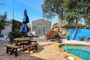 Village Oasis backyard pool and tiki house