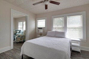 Queen sized bed with premium mattress and bed linens with storage.