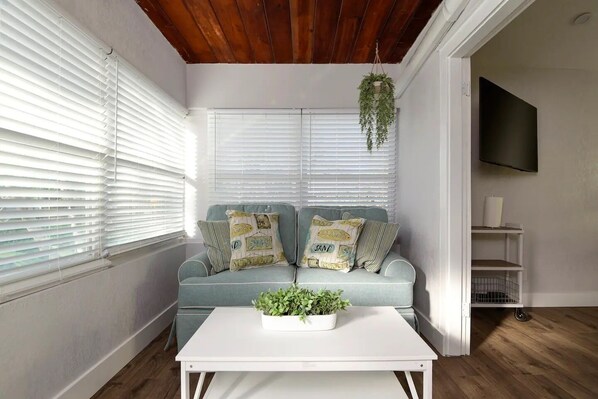 Cozy living room with sofa and center table.