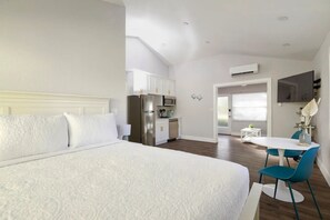 Queen sized bed with premium mattress and bed linens with storage.