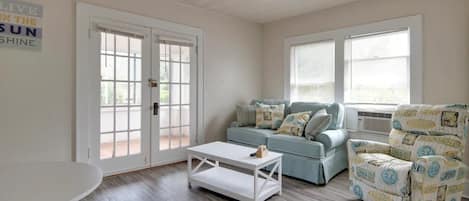 Cozy living room with sofa, and recliner.