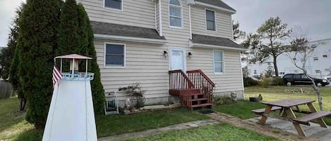 Front of unit. Parking- Up to 5 cars. Picnic table and BBQ grill available. 